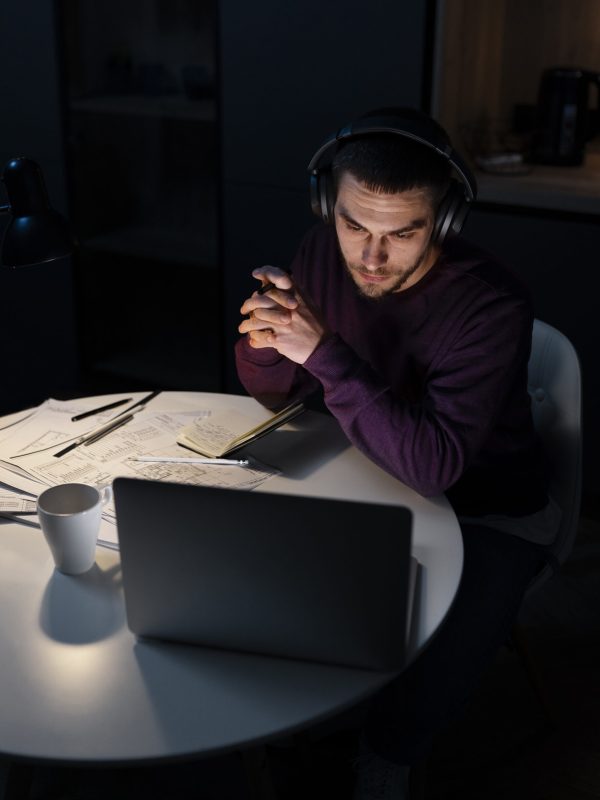 medium-shot-man-working-late-night-laptop